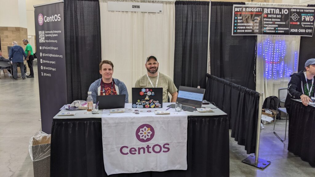 Shaun McCance and Carl George exhibiting at the CentOS booth